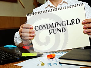 Commingled Fund papers in the man hands