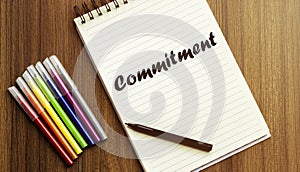 Commitment. your future target searching, a marker, pen, three colored pencils and a notebook for writing