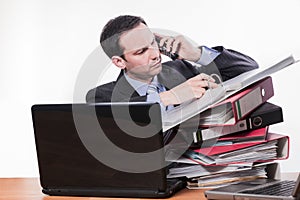 Committed employee checking file at phone