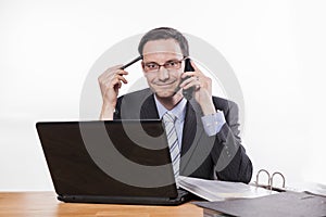 Committed employee with glasses smiling at phone