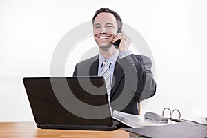 Committed employee smiling at phone photo
