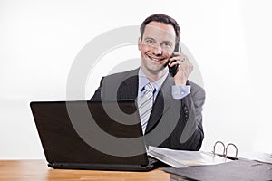 Committed employee smiling at phone photo
