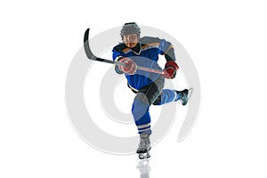 Committed hockey athlete showcases their mastery of attack and pass techniques against white studio background.