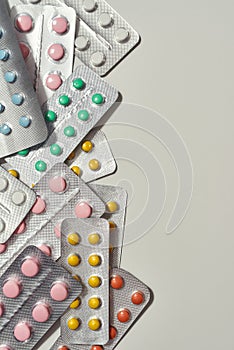 Committed to Care. Cropped shot of flat lay with many medical pills, tablets pack in blister lying randomly over white