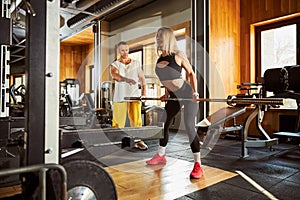 Committed woman doing her training at the gym