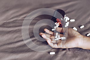 Committing suicide by overdosing on medication