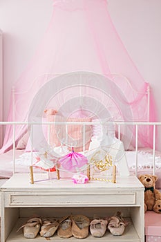 Commode with ballet shoes