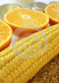 Commodity close up with milk, metal, oranges, corn and rice