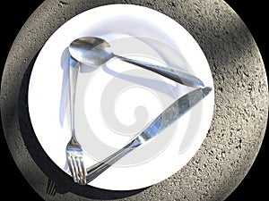 A common, brilliant white dinner plate with eating utensils knife, fork and spoon.