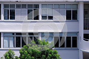 Common exterior view of old public housing featuring many windows, Tiong Bahru heartland estate. The art deco inspired