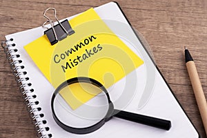 Common mistakes text on adhesive note