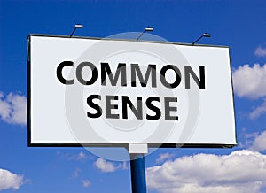 Common sense symbol. Concept words Common sense on beautiful big white billboard. Beautiful blue sky cloud background. Business,