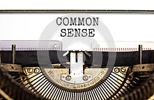 Common sense symbol. Concept words Common sense typed on beautiful old retro typewriter. Beautiful white paper background.