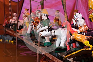 Common Vietnamese water puppets behind puppetry state. The control room is dark to hide puppeteers and instruments