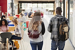 Communal Area Of Busy College Campus With Students