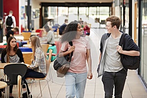 Communal Area Of Busy College Campus With Students