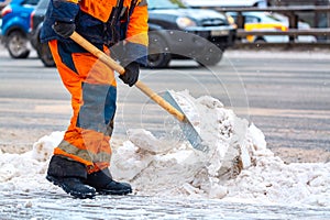 Communal services worker sweeps snow from road in winter, Cleaning city streets and roads during snowstorm. Moscow, Russia