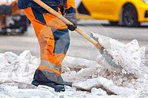 Communal services worker sweeps snow from road in winter, Cleaning city streets and roads during snowstorm. Moscow, Russia