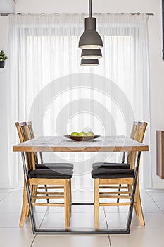 Communal table with chairs photo