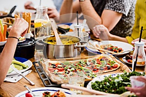 Communal table with fresh pizza