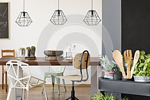 Communal table and pendant lamps