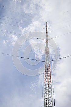 The communication antenna tower on blue sky