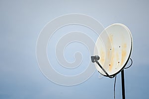 Communication concept with Satellite dish on sunshine background.