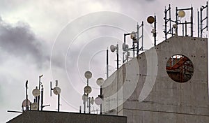 Communication Dishes on Roof Top