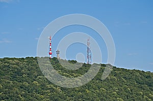 Communication and lookout towers on top of a hill near PEcs