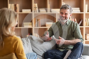 Communication In Marriage. Happy Middle Aged Couple Chatting At Home