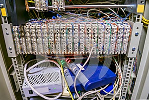 Communication patch panel for ip telephony. Modems and switches are in the datacenter server room box. The front panel of a