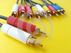 Communication rca audio video cable on a yellow background