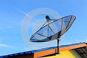 Communication satellite dish on roof