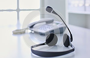 Communication support, call center and customer service help desk. VOIP headset on laptop computer keyboard