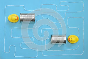 Communication Tin Can Phone With String and Yellow Toy Ducks