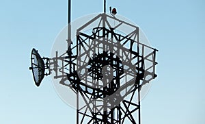 Communication tower against blue sky