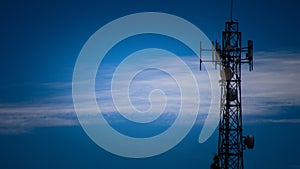 Communication tower on blue sky.