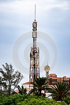 Communication tower with blue sky and clouds moving background