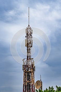 Communication tower with blue sky and clouds moving background