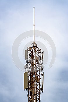Communication tower with blue sky and clouds moving background