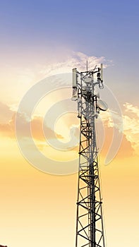 Communication tower network antenna for cellular telephone with sunset orange sky