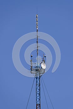 Communication tower with repeaters and satellite dish