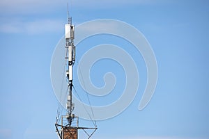 communication tower top. Radio antenna Tower , microwave antenna tower on light sky background. wireless technology