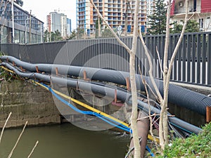 Communications go under the bridge on the river. Wires and pipes under the bridge. Gas pipeline electricity