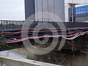 Communications go under the bridge on the river. Wires and pipes under the bridge. Gas pipeline electricity