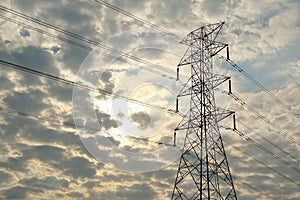 Communications tower with black cloudy sky background.