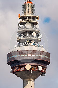 Communications tower of the city of Madrid with a multitude of antenna and signal transmission devices.