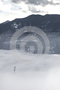 Communications tower in fog colorado rockies frozen snow winter landscape