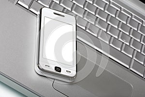 Communicator with white screen on silver laptop. photo