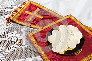 Communion hosts or wafers and vestment